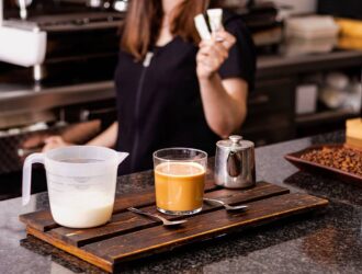 waitress-offering-sugar-for-a-cup-of-coffee-2023-11-27-05-10-58-utc (1)
