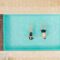 top view of couple lying in swimming pool and holding hands in Italy